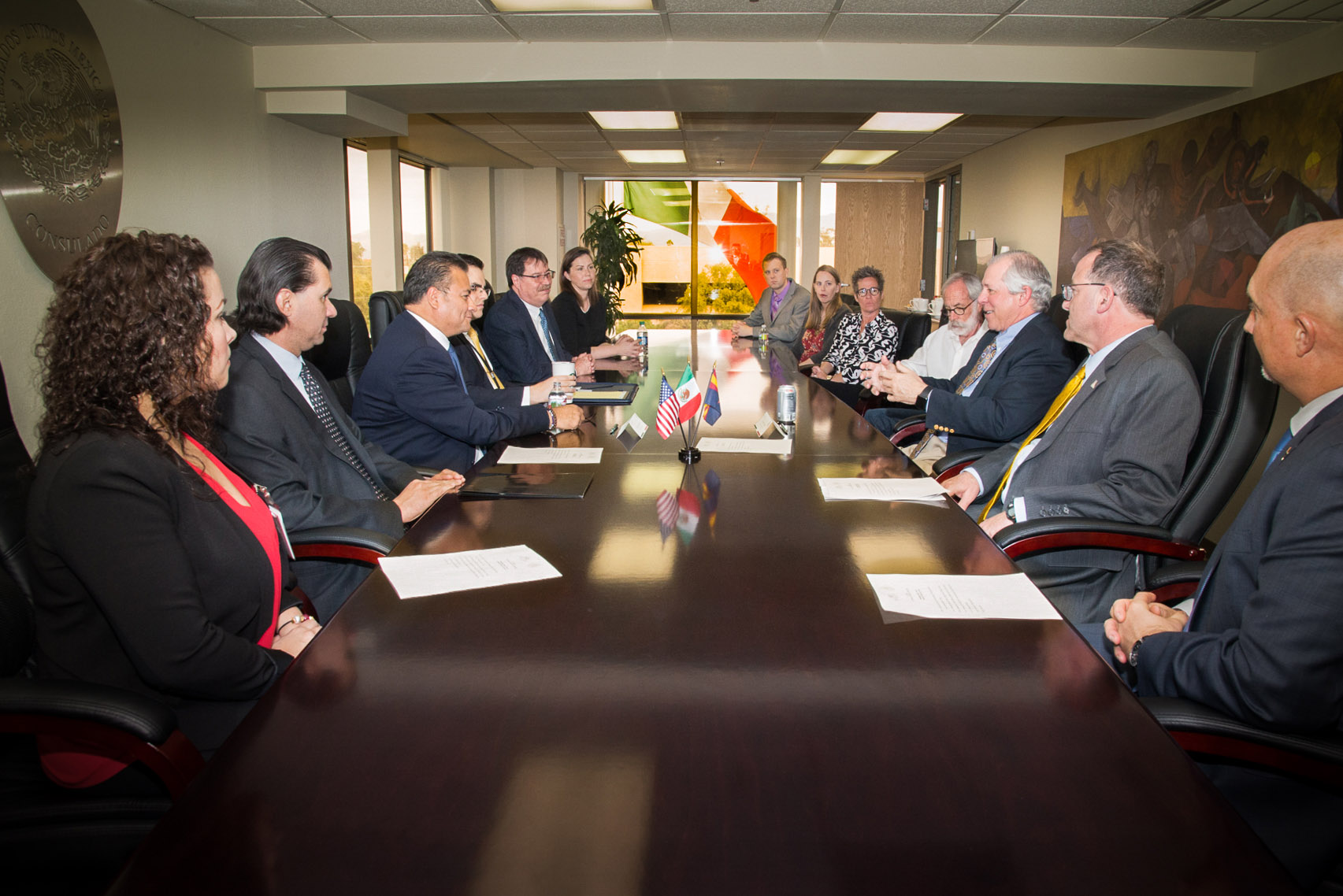Leaders from the Mexican Foreign Ministry, the University of Arizona and the James E. Rogers College of Law sit around a table to sign a partnership agreement to teach law to Mexican diplomats