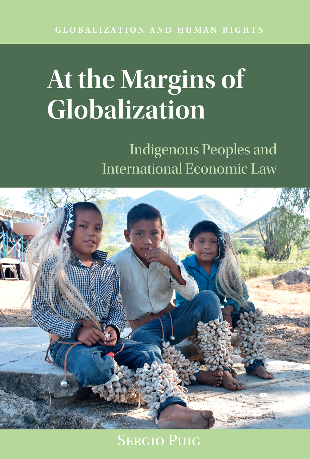 Book cover for "At the Margins of Globalization" by Sergio Puig with photo of three young indigenous boys