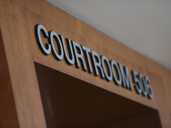 Close-up of a "Courtroom" sign