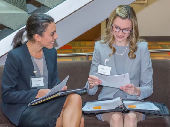 Two female University of Arizona Law students talk during the Sonoran Desert Career Fair