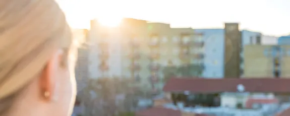 Blonde facing city