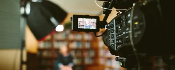 A Sony FS7 camera system filming an interview in an office
