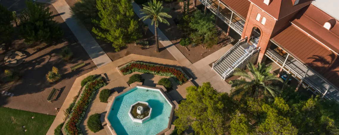 Overhead view of Old Main historic building and blue fountain