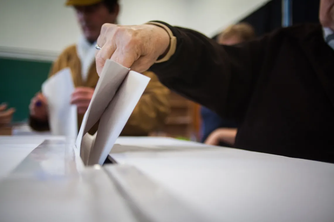 Closeup of person voting at polling station