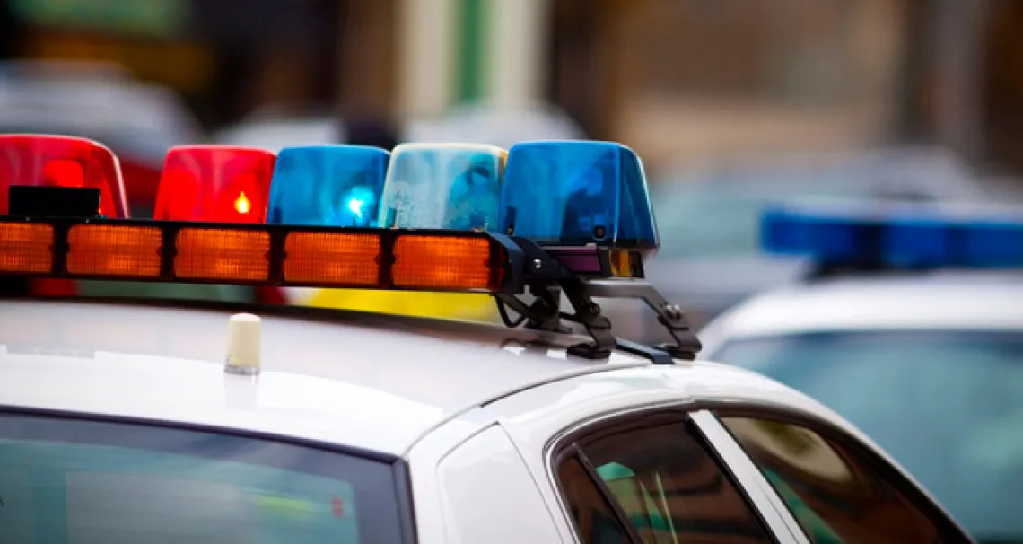 Red and blue lights on top of a police car