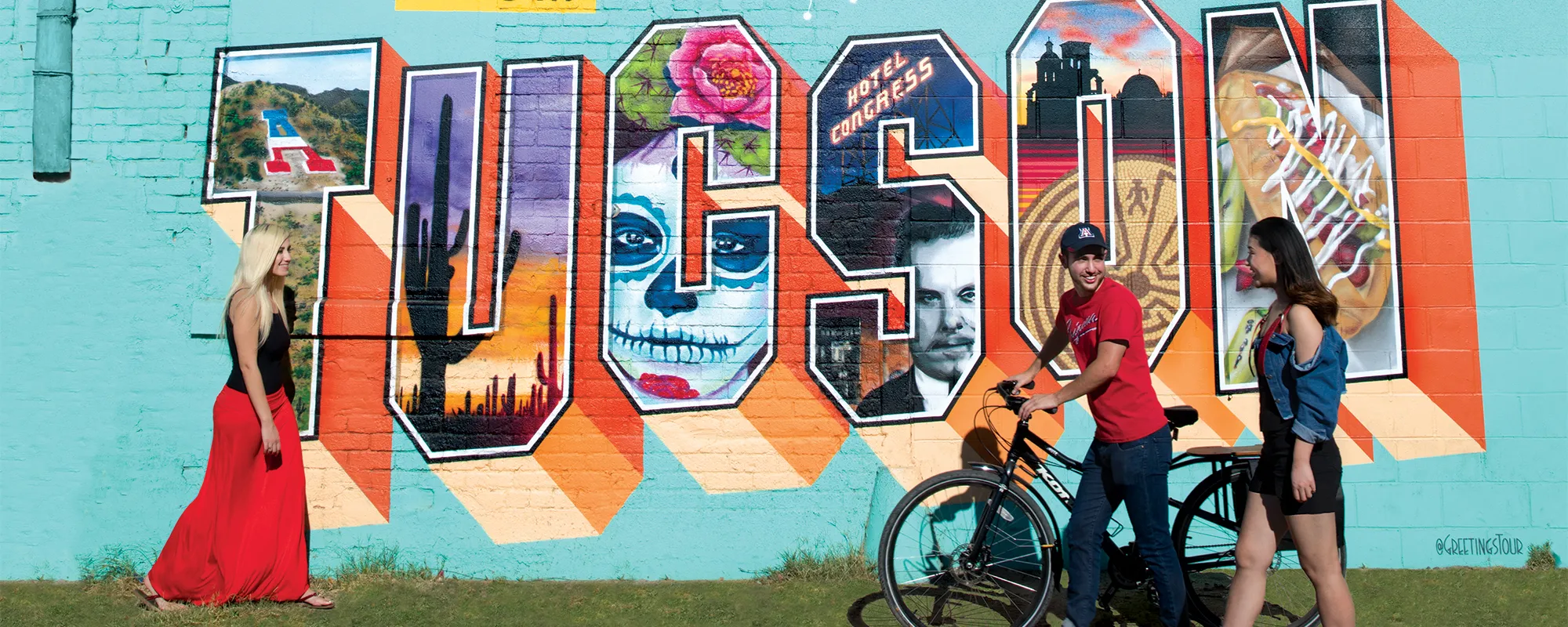 Greetings from Tucson mural with University of Arizona Law students walking in front