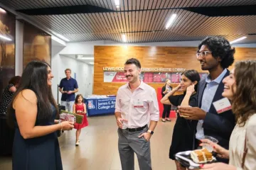 Roopali speaking with students