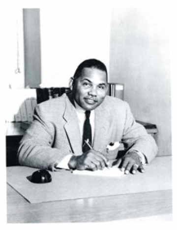 Hayzel B. Daniels at a desk