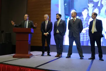 From left: Marc Miller, Brent White and the UA leads at OUC: Andrew Shepherd, professor of practice, Global Law; Michael Sayle, professor of English; and Robert Woods, director of the UA Law program at Ocean University of China.