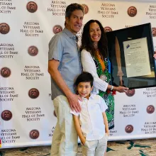 Kristine Huskey with her husband Bryan Di Lella and their son Luke.